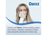 Woman covering her nose with a napkin.